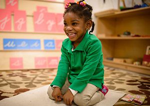 Charter elementary school student plays in her classroom
